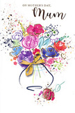 This Mother's Day card showcases a joyful yet serene bouquet, painted in a loose watercolour style that mirrors the natural elegance of fresh arrangements crafted in Gidea Park. At its heart, bold pink and magenta blooms open wide, their rose-like shapes marked by fluid, overlapping brushstrokes that suggest softness and fullness. The intense warmth of these central flowers is offset by smaller blossoms in shades of lavender and powdery blue, which thread through the bouquet like calming breaths, easing the eye from one vivid petal to the next. Subtle gold accents pick out selected edges and details, shimmering gently as though the bouquet were catching the last rays of a spring evening sun. The white background remains largely untouched, giving the colours space to glow, yet scattered droplets and swirls of pigment create a halo of lively energy around the flowers, evoking the feeling of petals swirling through the air or the cheerful bustle of a family home on Mother's Day. The arrangement is gathered into a softly outlined vase at the bottom, brushed in translucent tones that hint at glass or glazed ceramic, and finished with a ribbon tied neatly in a bow. This simple flourish recalls the moment a florist ties off a hand-tied bouquet just before sending it out for delivery around Gidea Park, Romford, and the surrounding neighbourhoods. The overall impression is one of gentle celebration and heartfelt thanks, a painted bouquet that carries with it all the emotion of giving real flowers, designed to honour the care, strength, and kindness of a much-loved mum.